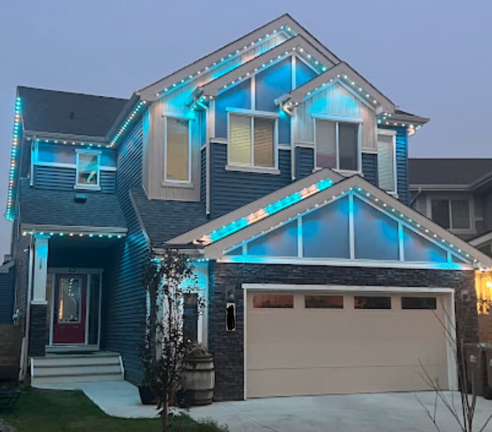 Home lit teal at dusk